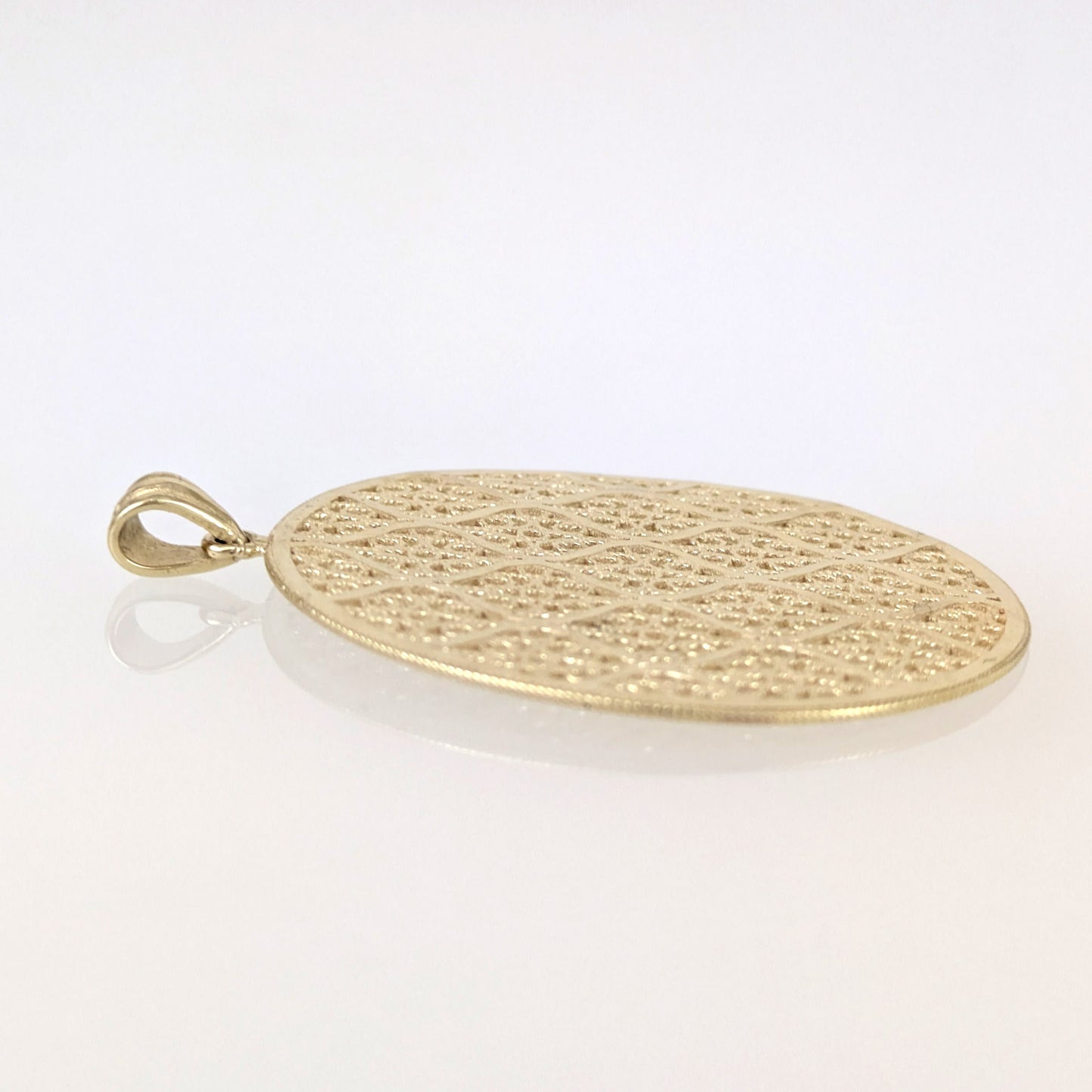 Gold pendant on a white background