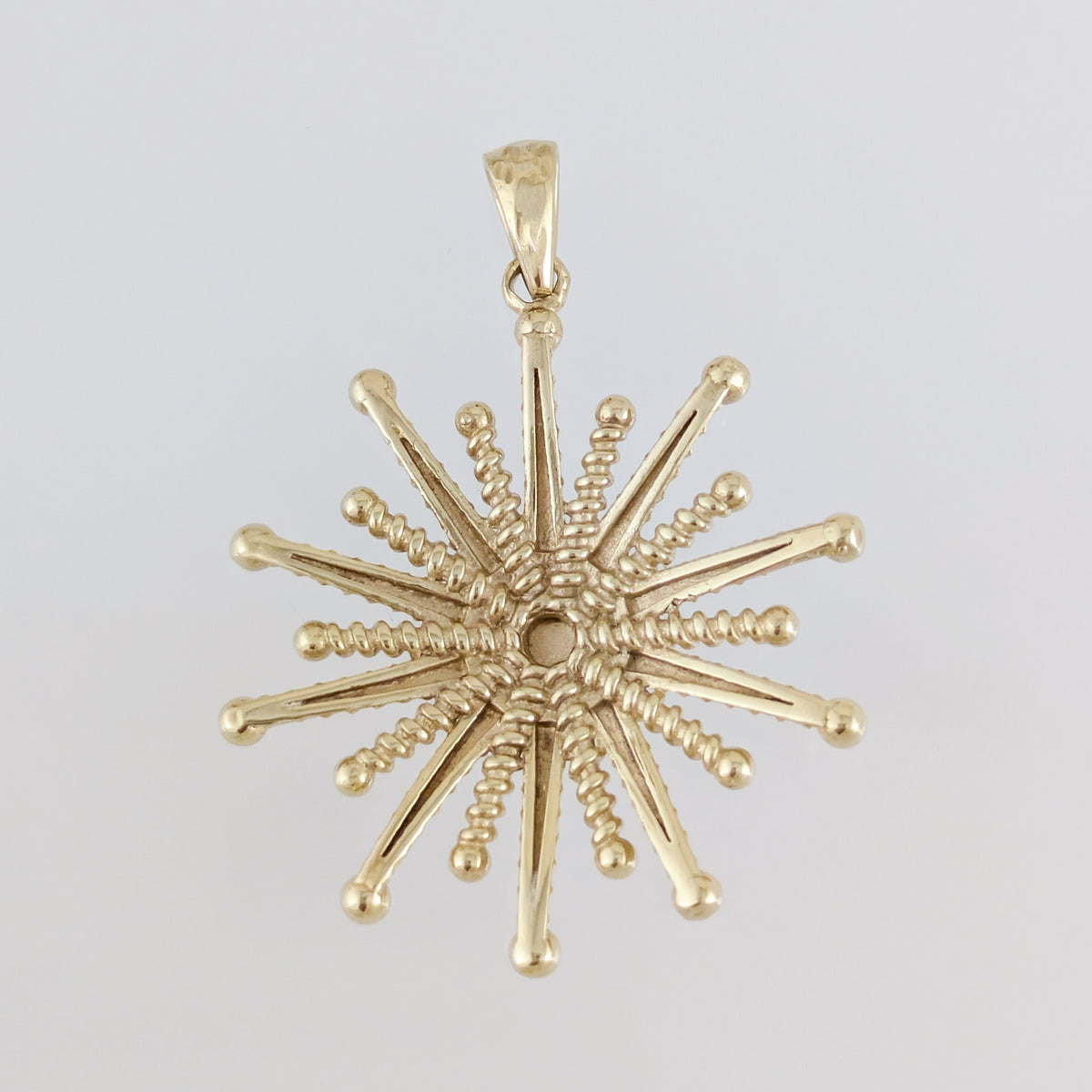 Round Starburst Pendant with Radiating Sculptural Detail