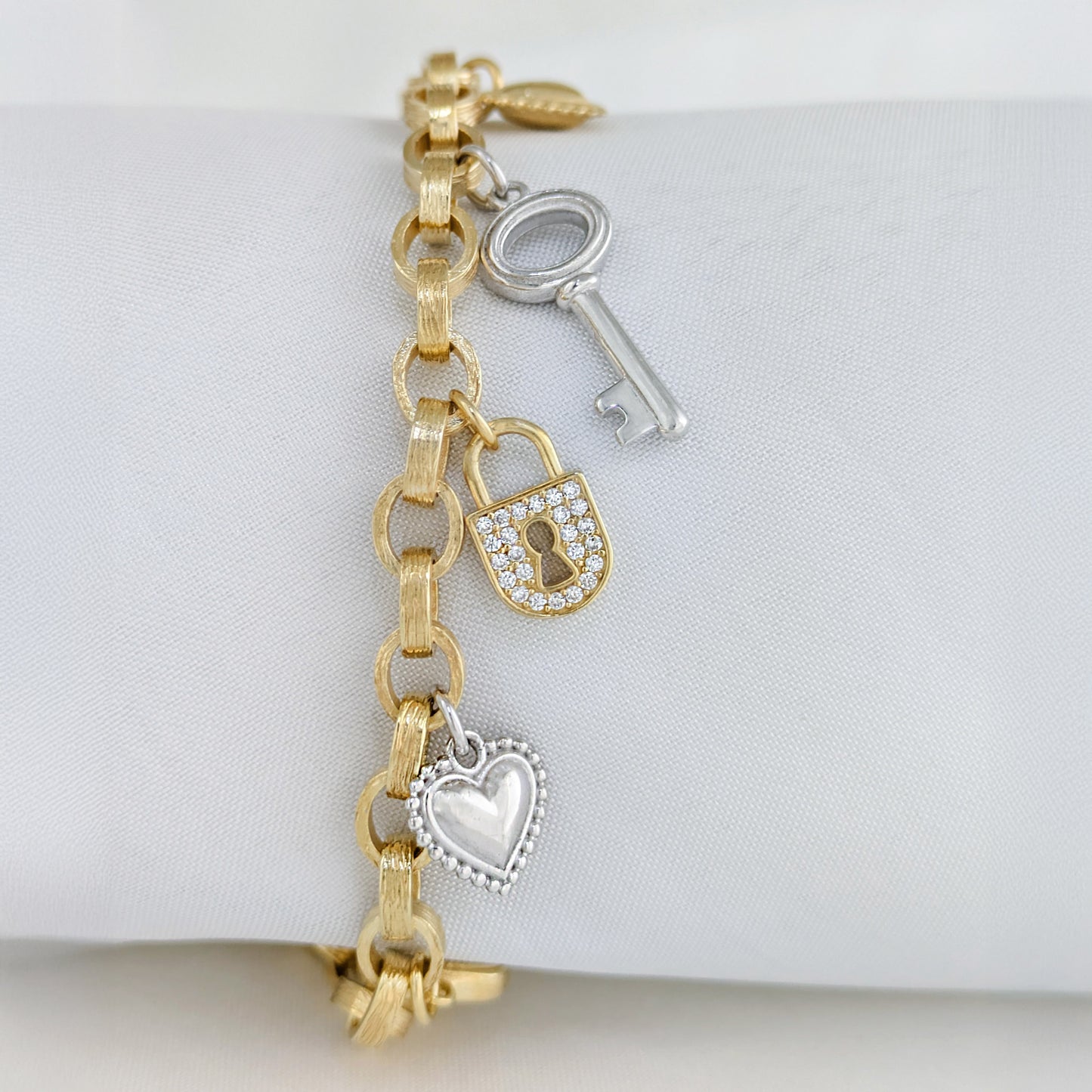 Two-Tone Lock & Key Charm Bracelet with Heart Accents