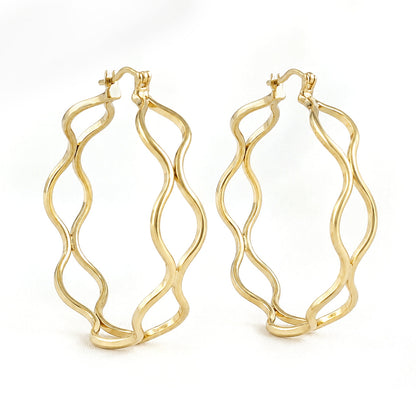 A pair of gold hoop earrings with a wavy, open-frame design, displayed on a clean white background.