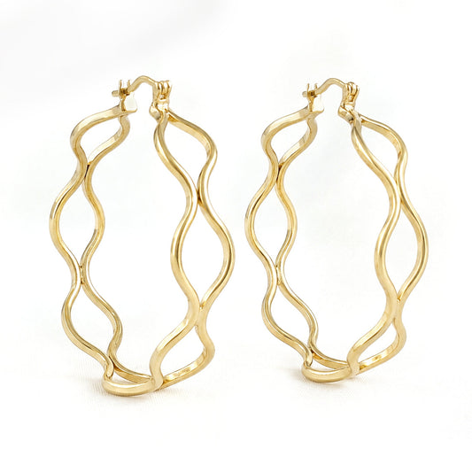 A pair of gold hoop earrings with a wavy, open-frame design, displayed on a clean white background.