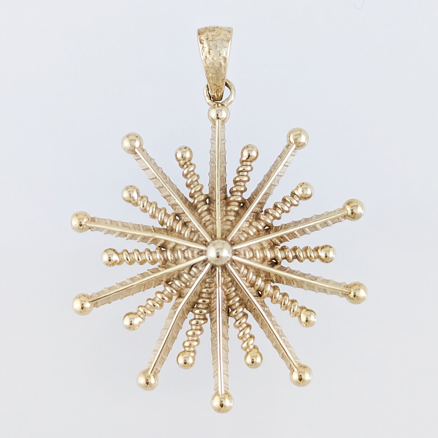 Round Starburst Pendant with Radiating Sculptural Detail