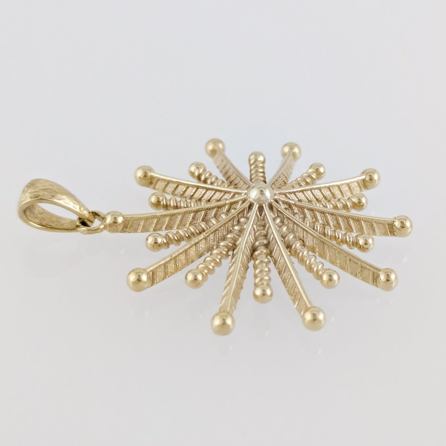 Round Starburst Pendant with Radiating Sculptural Detail