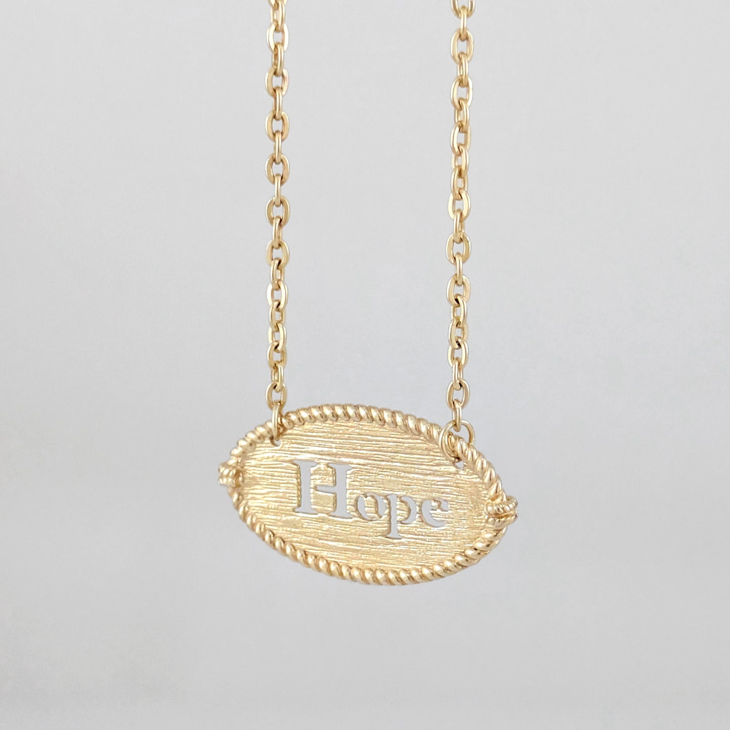 Oval Hope Cutout Necklace with Textured Pendant