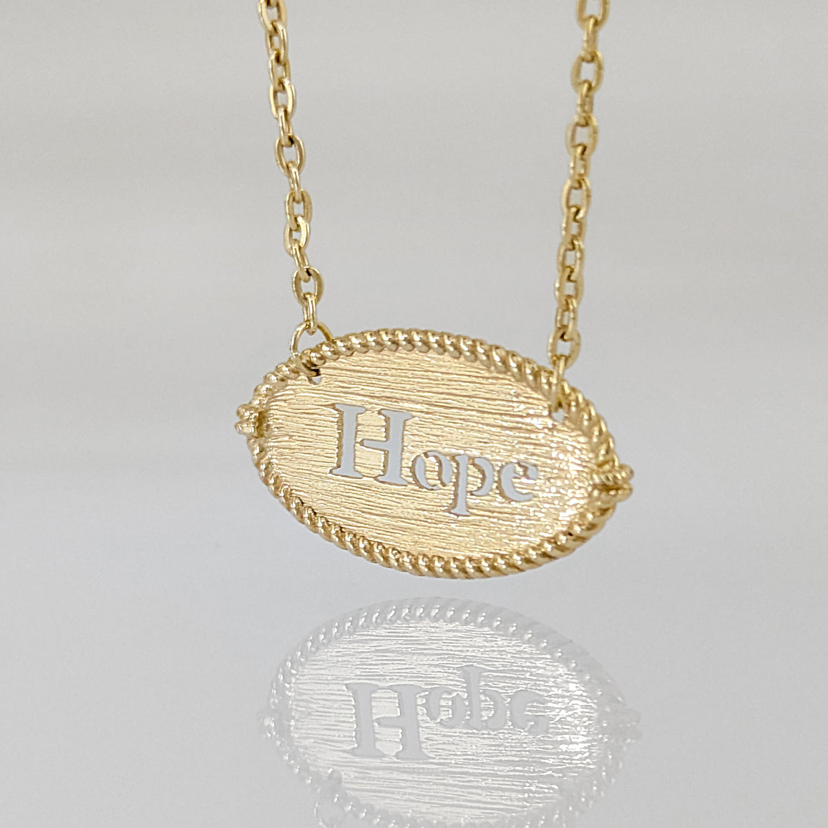 Oval Hope Cutout Necklace with Textured Pendant