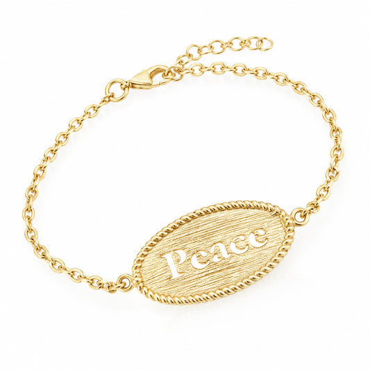 A gold chain bracelet with an oval textured pendant engraved with the word 'Peace', shown on a clean white background.