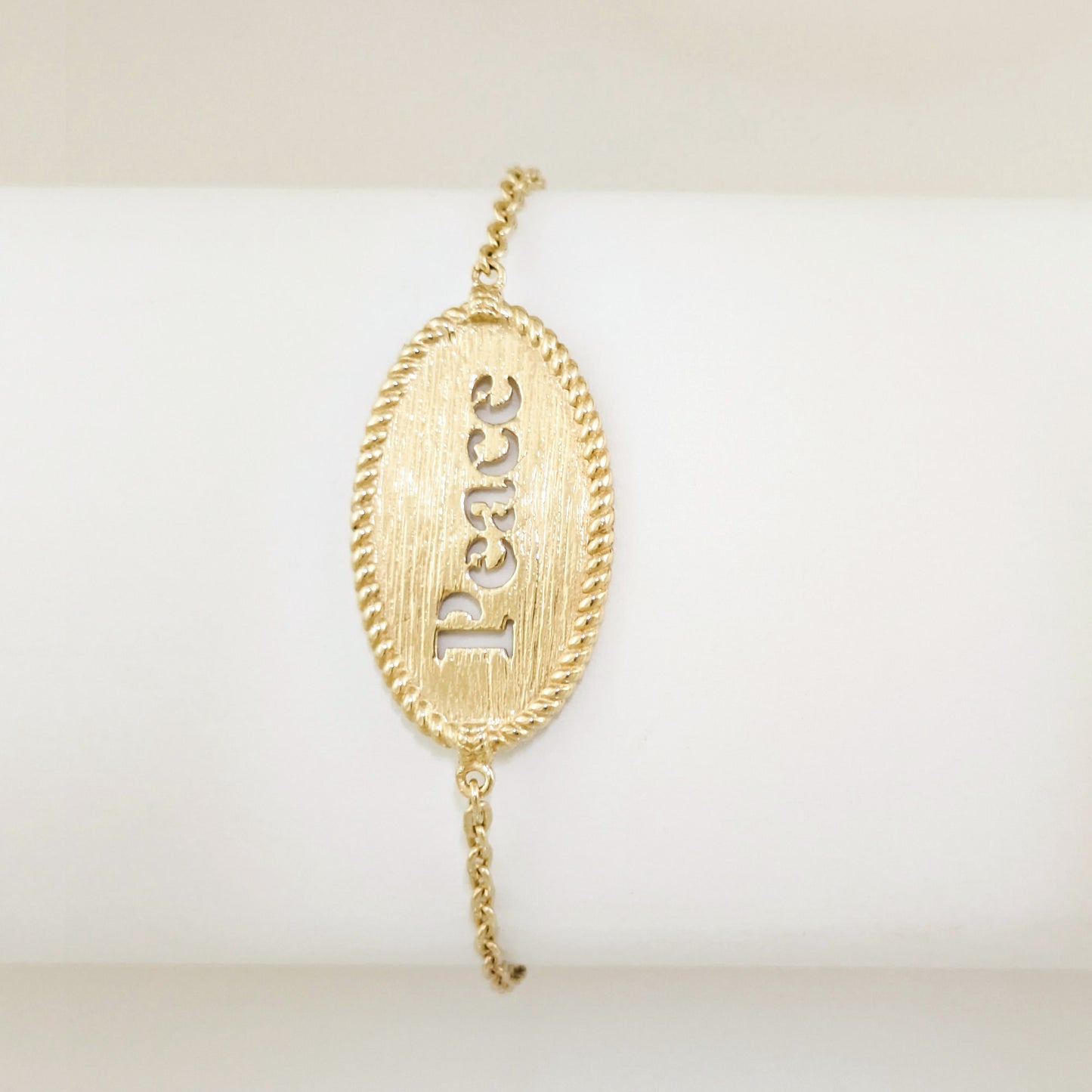 Oval Peace Cutout Bracelet with Textured Rope Border