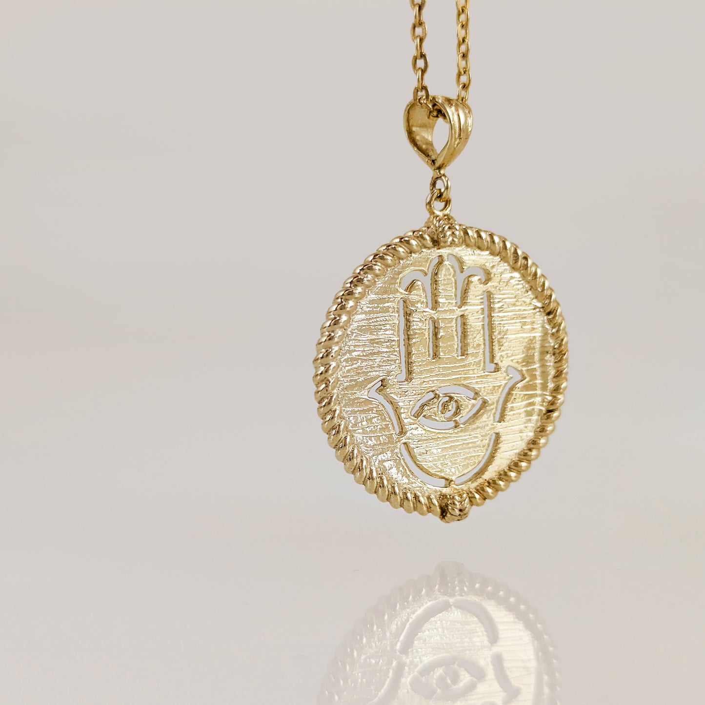 Round Hamsa Hand and Evil Eye Cutout Pendant