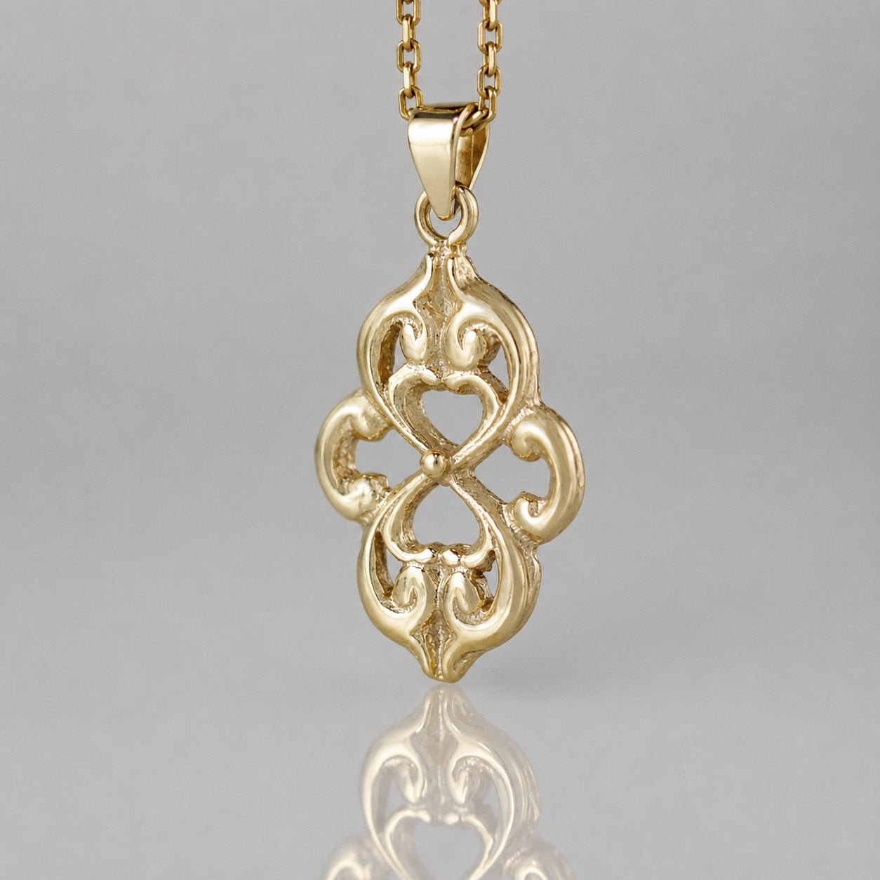 Openwork Quatrefoil Heart Scroll Pendant