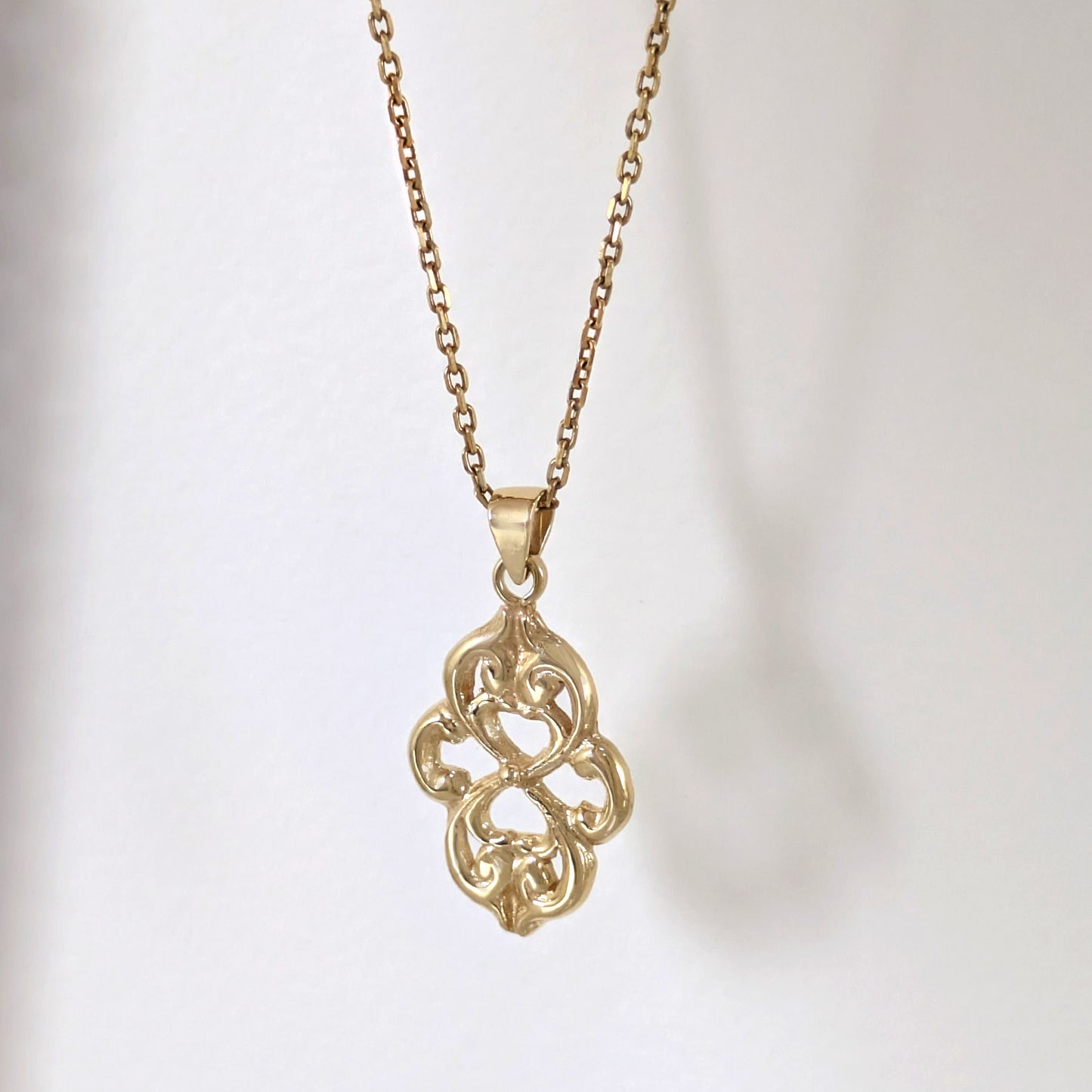 Openwork Quatrefoil Heart Scroll Pendant
