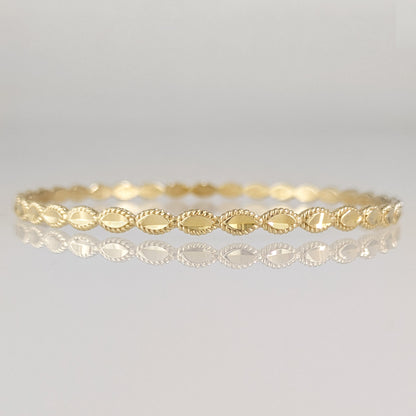 Textured Oval Link Bangle Bracelet with Sparkling Diamond Cut