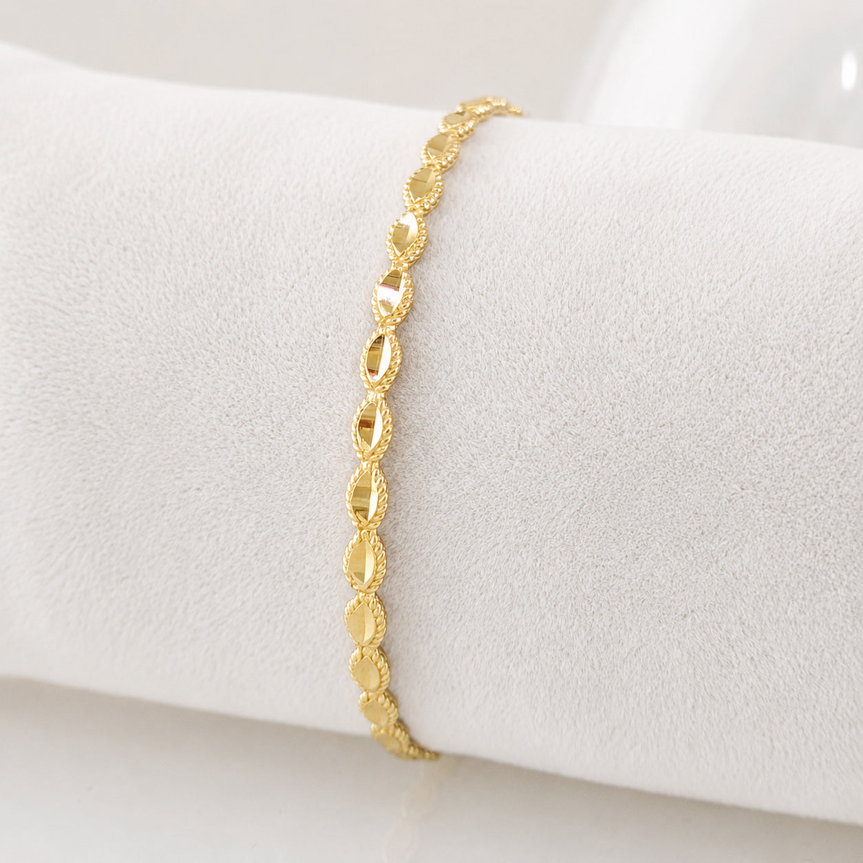Textured Oval Link Bangle Bracelet with Sparkling Diamond Cut