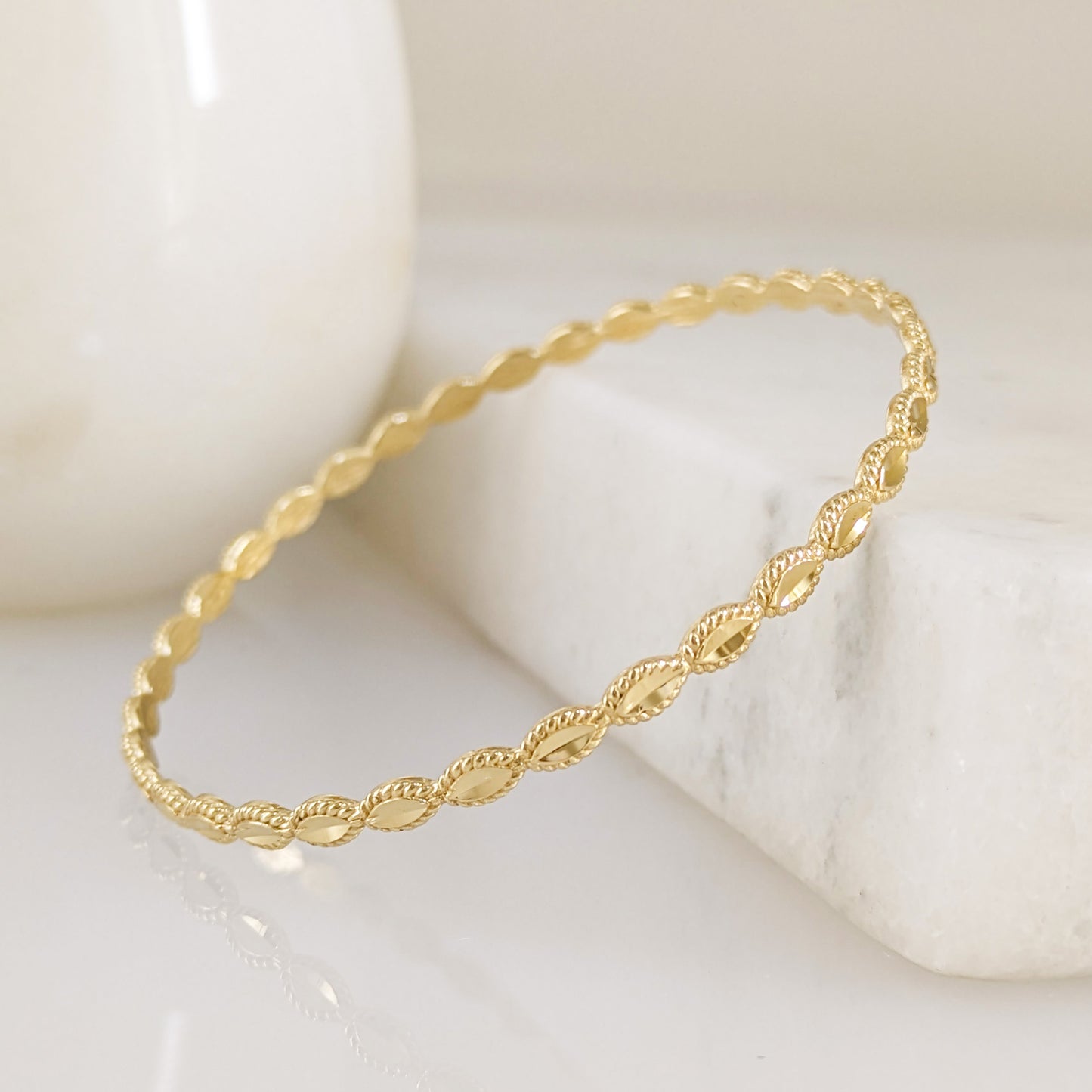 Textured Oval Link Bangle Bracelet with Sparkling Diamond Cut