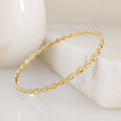 Textured Oval Link Bangle Bracelet with Sparkling Diamond Cut