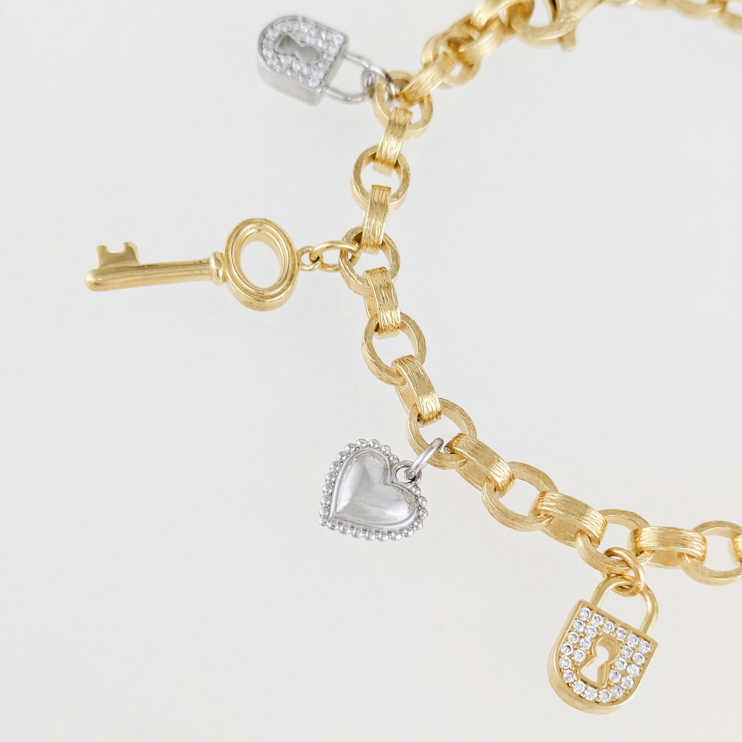 Two-Tone Lock & Key Charm Bracelet with Heart Accents