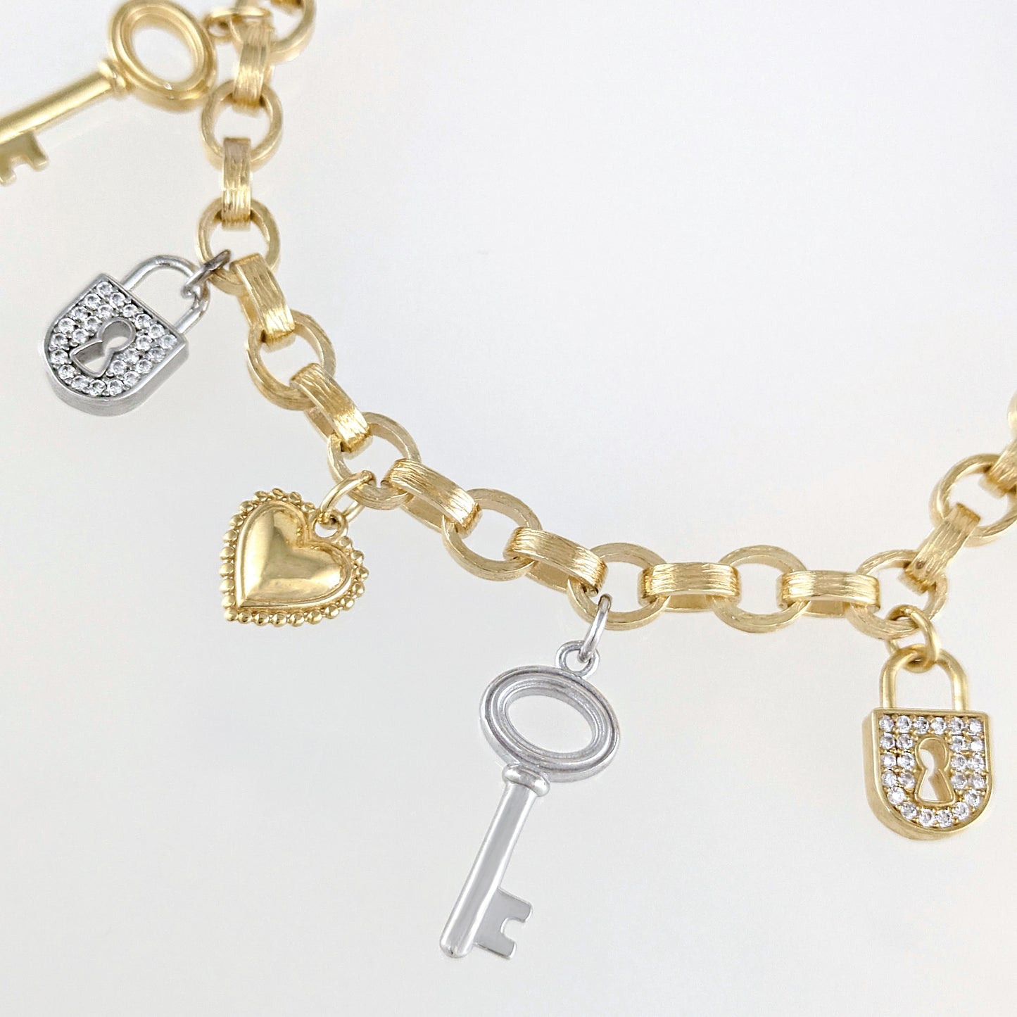 Two-Tone Lock & Key Charm Bracelet with Heart Accents