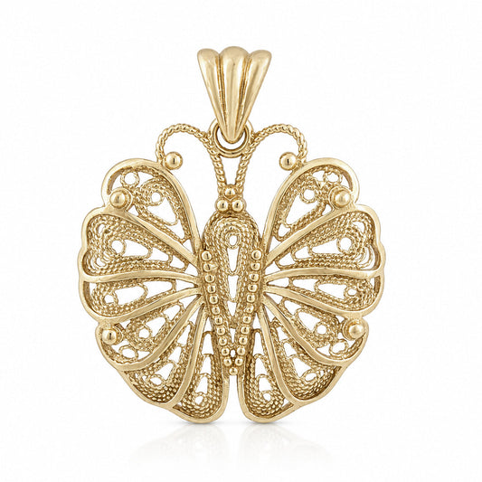 A yellow gold butterfly pendant with intricate filigree detailing and a textured beaded pattern, shown on a clean white background.