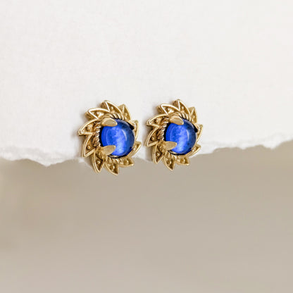 Blue Crystal Cabochon Stud Earrings with Ornate Sunburst Design