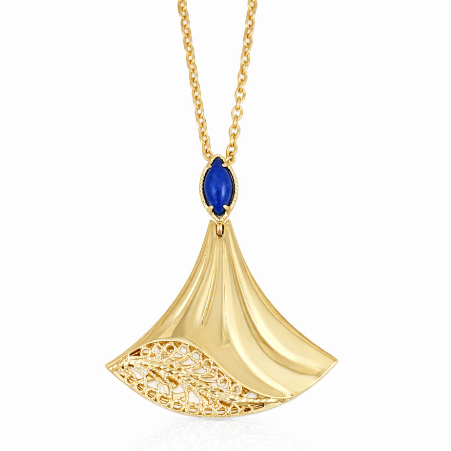 Gold pendant with a blue gemstone on a white background