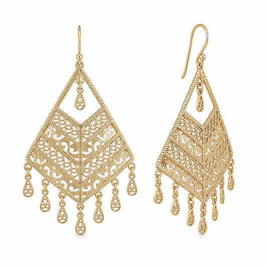 A pair of gold filigree dangle earrings with teardrop-shaped drops, shown on a plain white background.