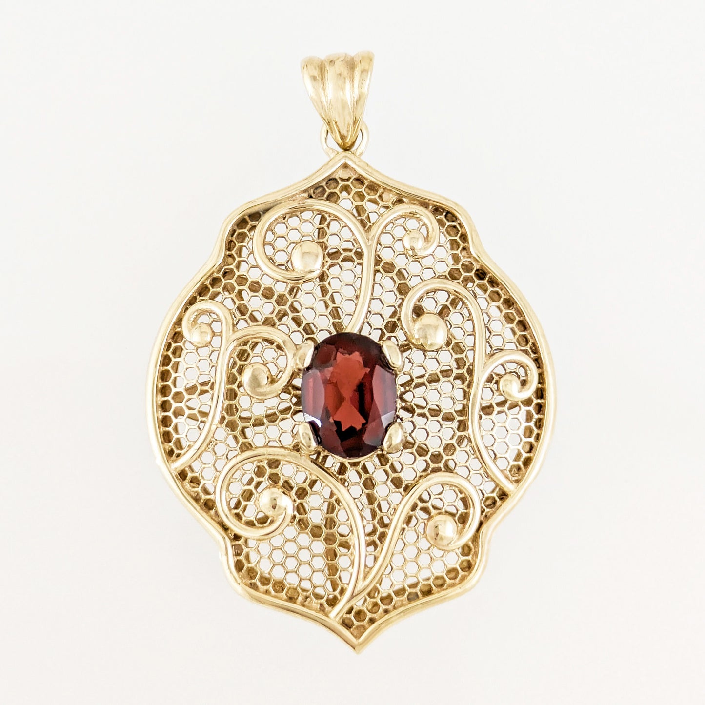 Natural Garnet Filigree Pendant with Ornate Scrollwork Design