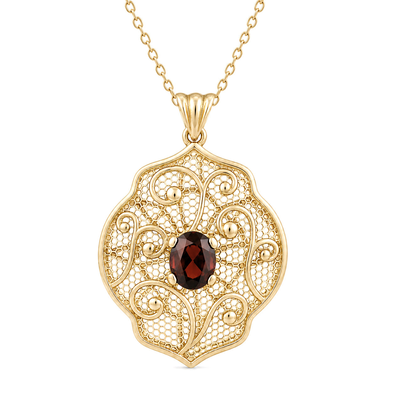 A gold filigree pendant necklace featuring an oval dark red garnet gemstone at the center, suspended from a delicate gold chain against a plain white background.