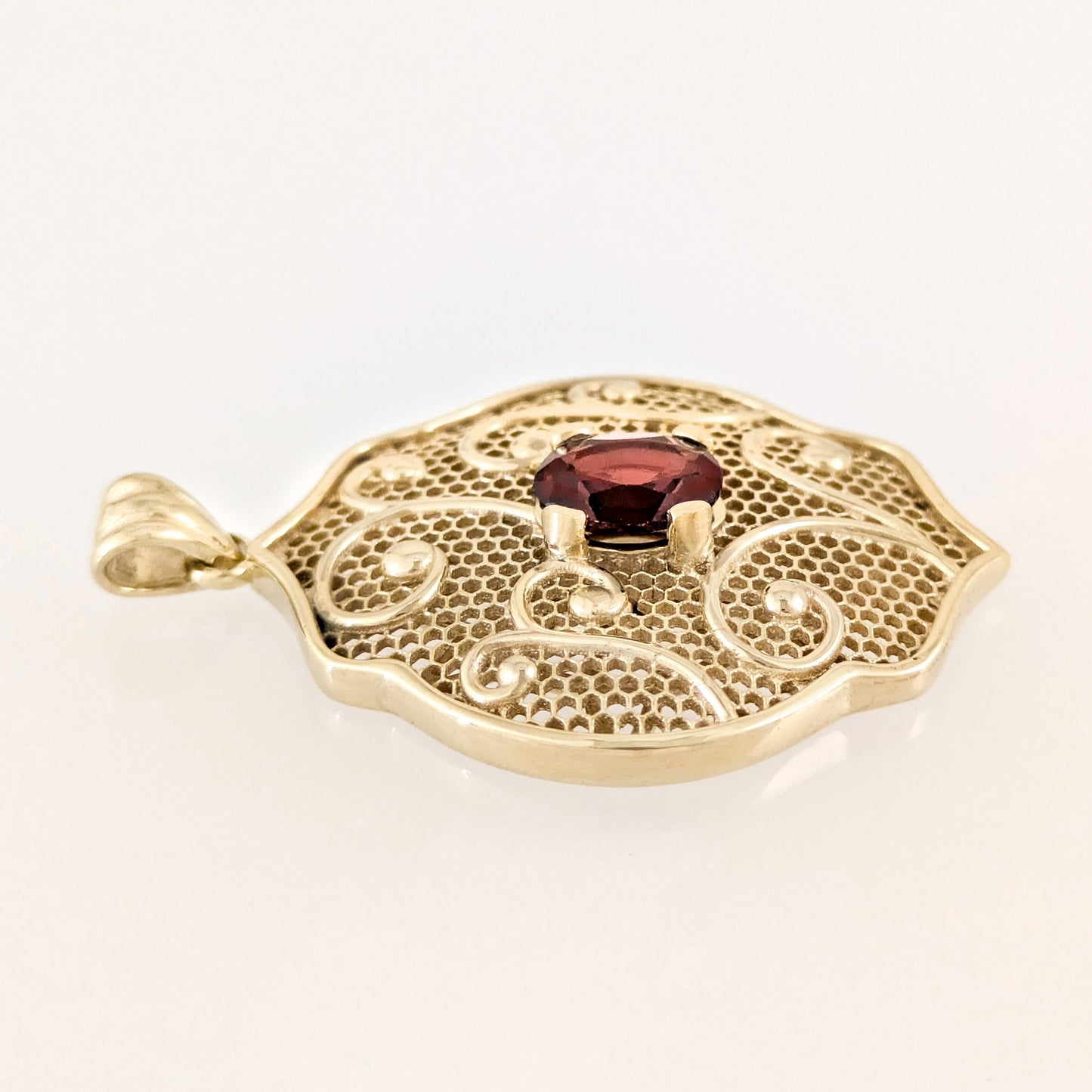 Natural Garnet Filigree Pendant with Ornate Scrollwork Design