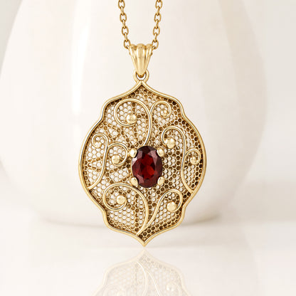 Natural Garnet Filigree Pendant with Ornate Scrollwork Design