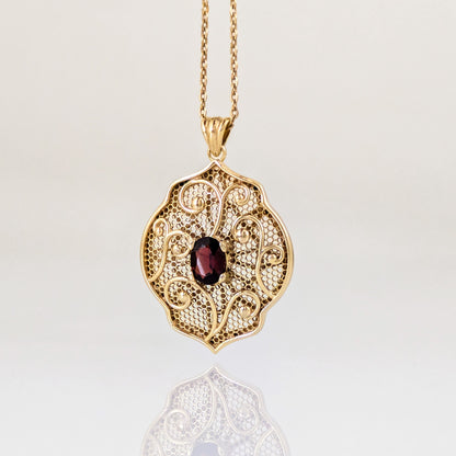 Natural Garnet Filigree Pendant with Ornate Scrollwork Design