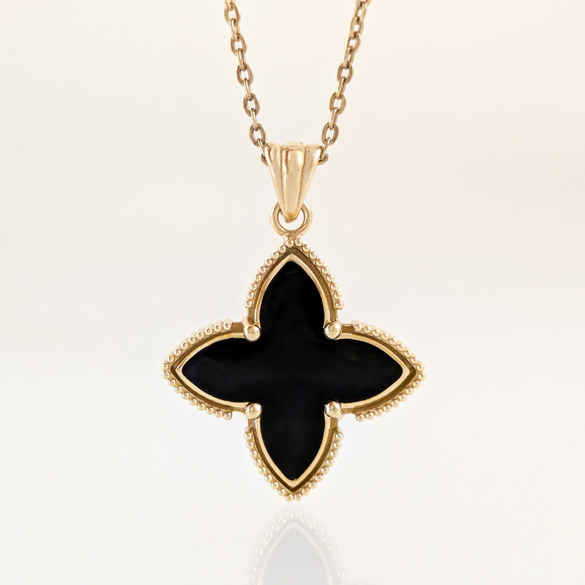 Black Four-Petal Pendant with Beaded Border