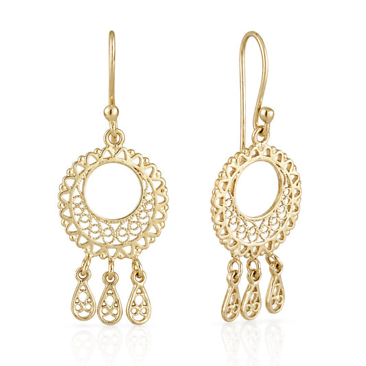 A pair of gold filigree dangle earrings with circular openwork designs and three teardrop-shaped dangling charms, shown on a clean white background with a soft reflection.