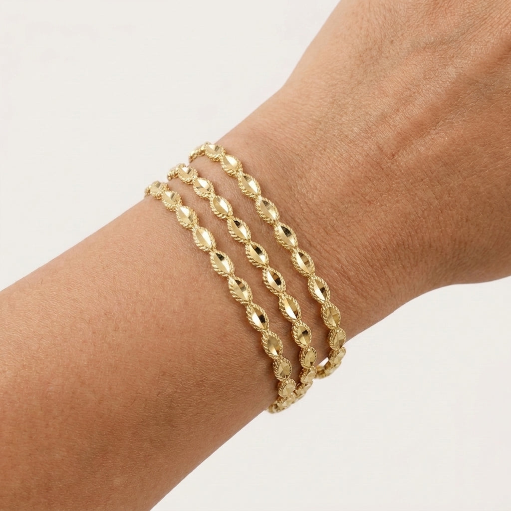 Textured Oval Link Bangle Bracelet with Sparkling Diamond Cut