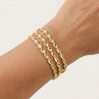 Textured Oval Link Bangle Bracelet with Sparkling Diamond Cut
