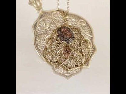 Natural Garnet Filigree Pendant with Ornate Scrollwork Design